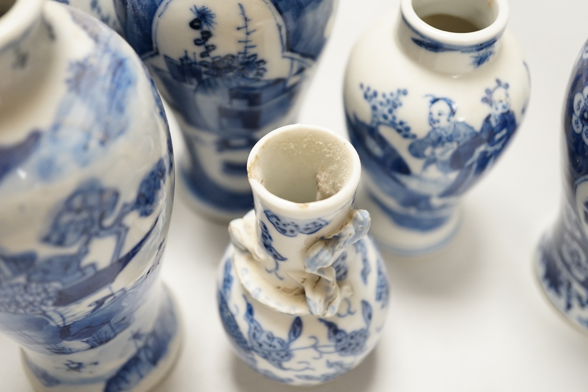 A Chinese armorial blue and white bottle vase, Qianlong/Jiaqing period, and five assorted 19th century Chinese blue and white vases, tallest 20cm; faults